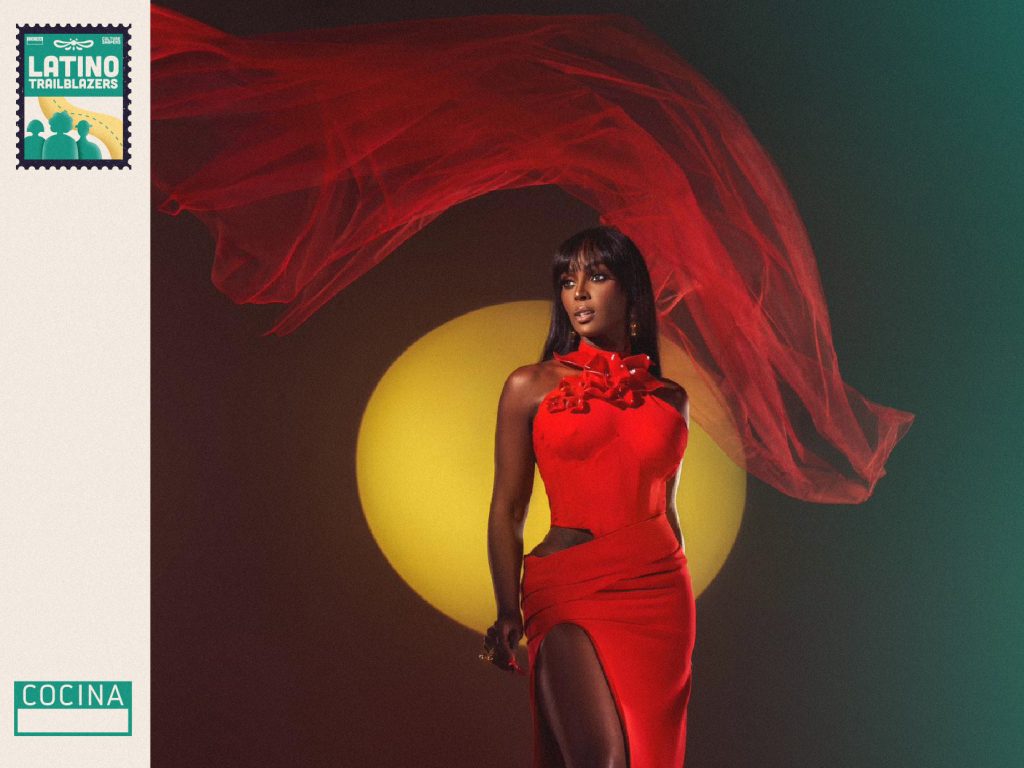 Amara La Negra, part of Latino Trailblazers, at a photoshoot in a red dress. Photo courtesy of Amara La Negra.
